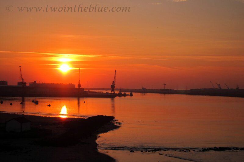 Sunset over Harbor — Orange, Serene, Photograph, Cranes