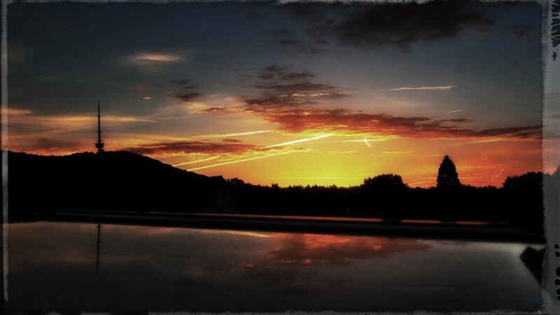 Sunset over Hill with Tower — Orange, Dramatic, Photograph