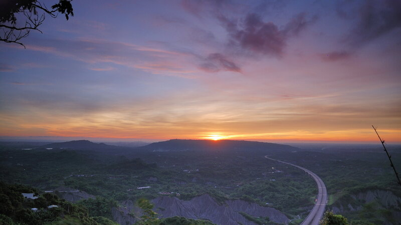 Sunset over Hills and Highway