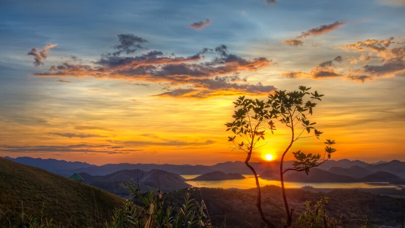 Sunset over Hills and Lake — Orange