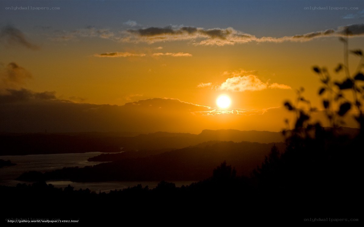 Sunset over hills and lake