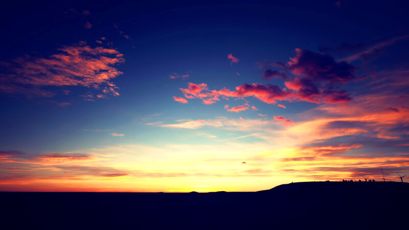 Sunset over Hills — Blue, Dramatic, Photograph, Clouds, Wind Turbines