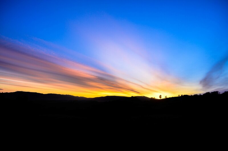 Sunset over Hills — Blue, Serene, Photograph, Clouds