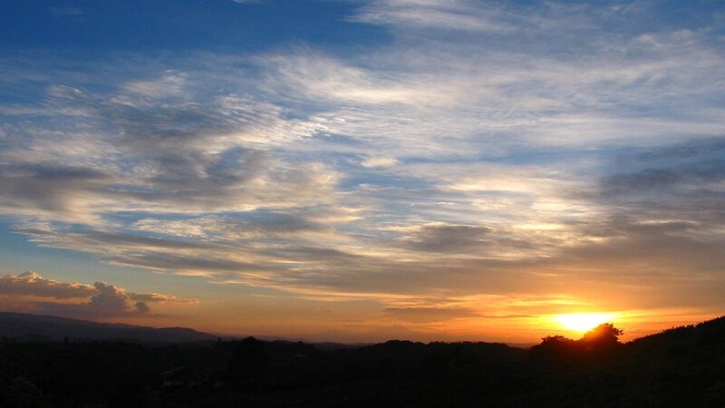 Sunset over Hills — Blue, Serene, Photograph, Sun, Clouds