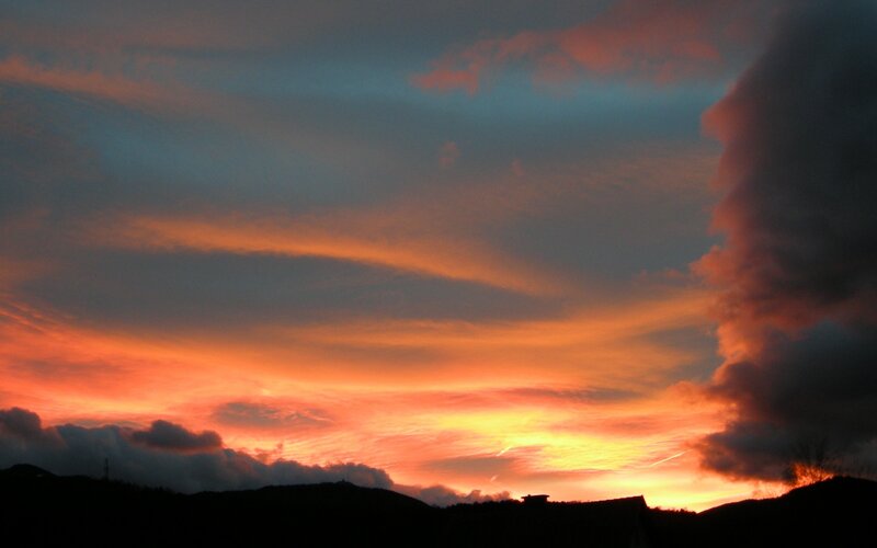 Sunset over Hills — Orange, Dramatic, Photograph, Clouds, Sky, Silhouette