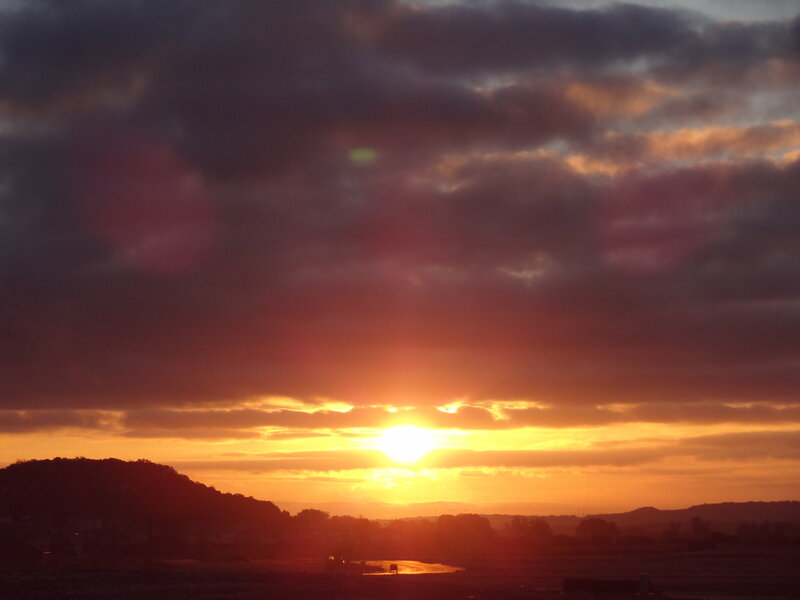 Sunset over Hills — Orange, Dramatic, Photograph, Clouds, Sun