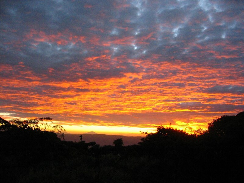 Sunset over Hills — Orange, Dramatic, Photograph, Clouds