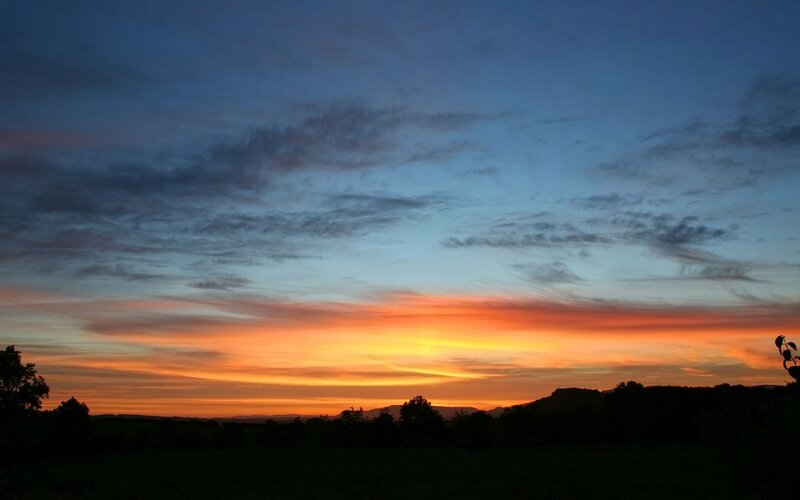 Sunset over Hills — Orange, Serene, Photograph, Trees, Clouds