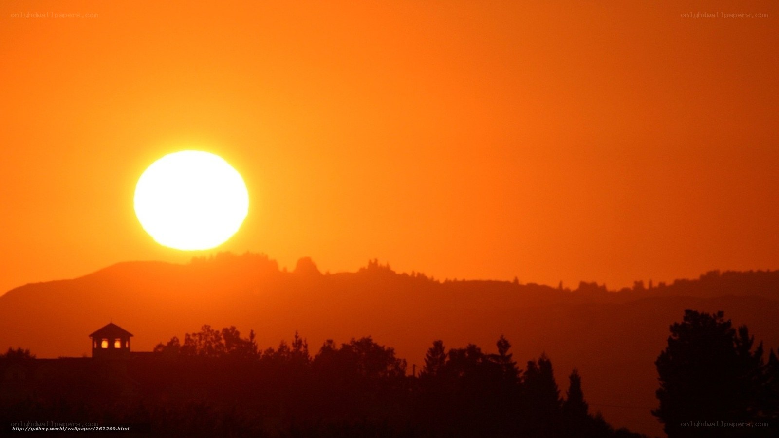 Sunset over hills with tower