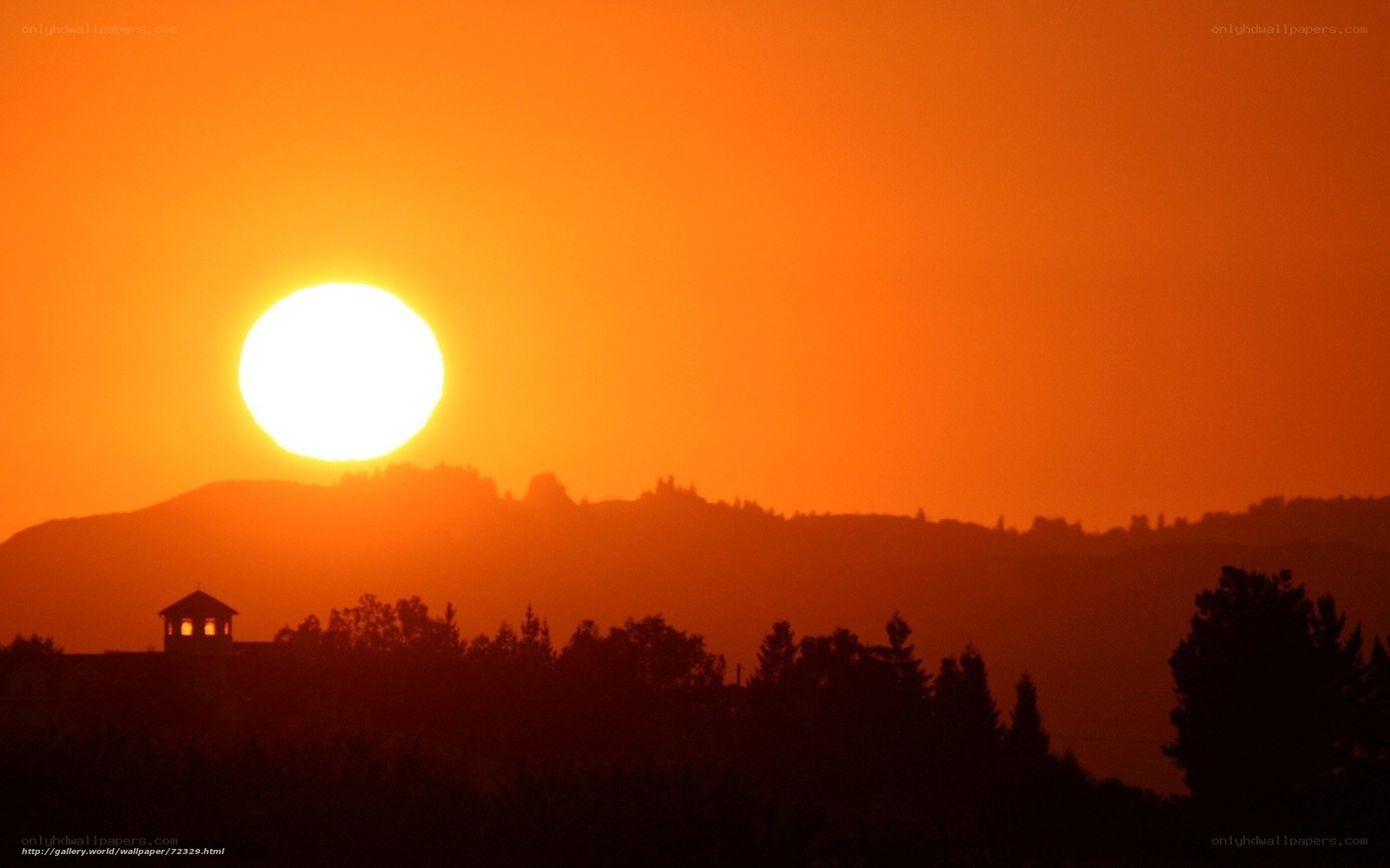 Sunset over hills with tower
