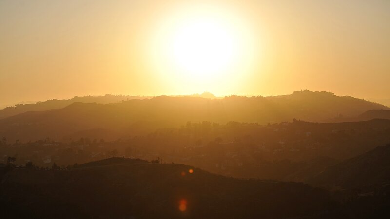 Sunset over hilly landscape
