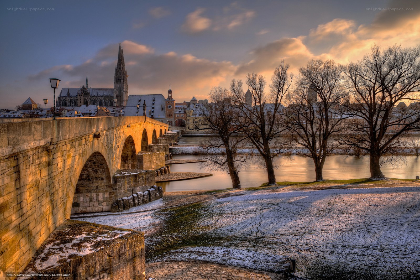 Sunset over historic bridge and cathedral