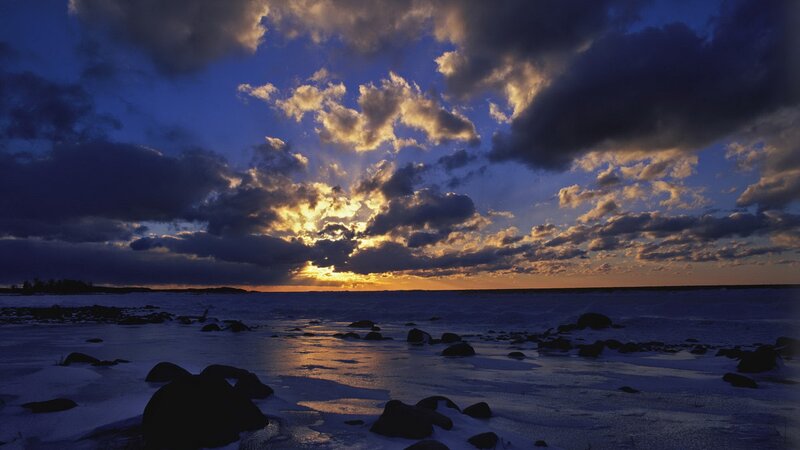 sunset over icy coastline