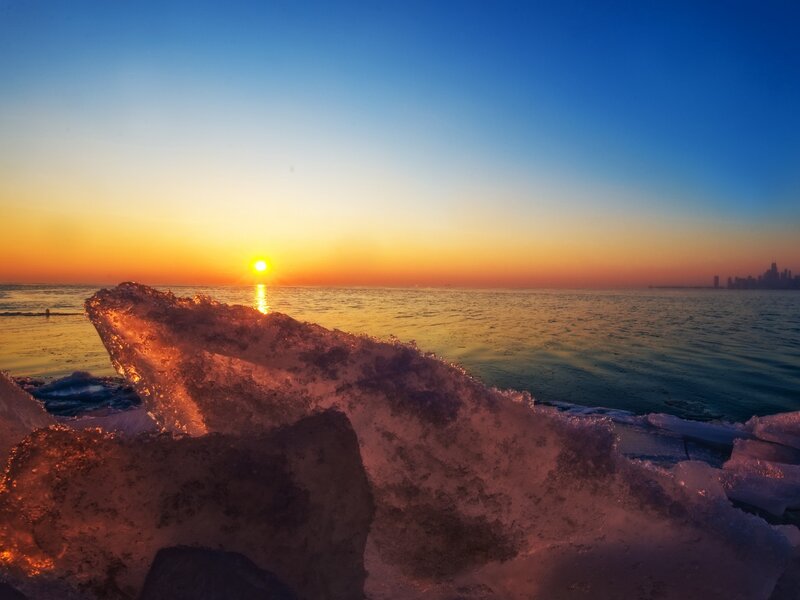 Sunset over icy lake