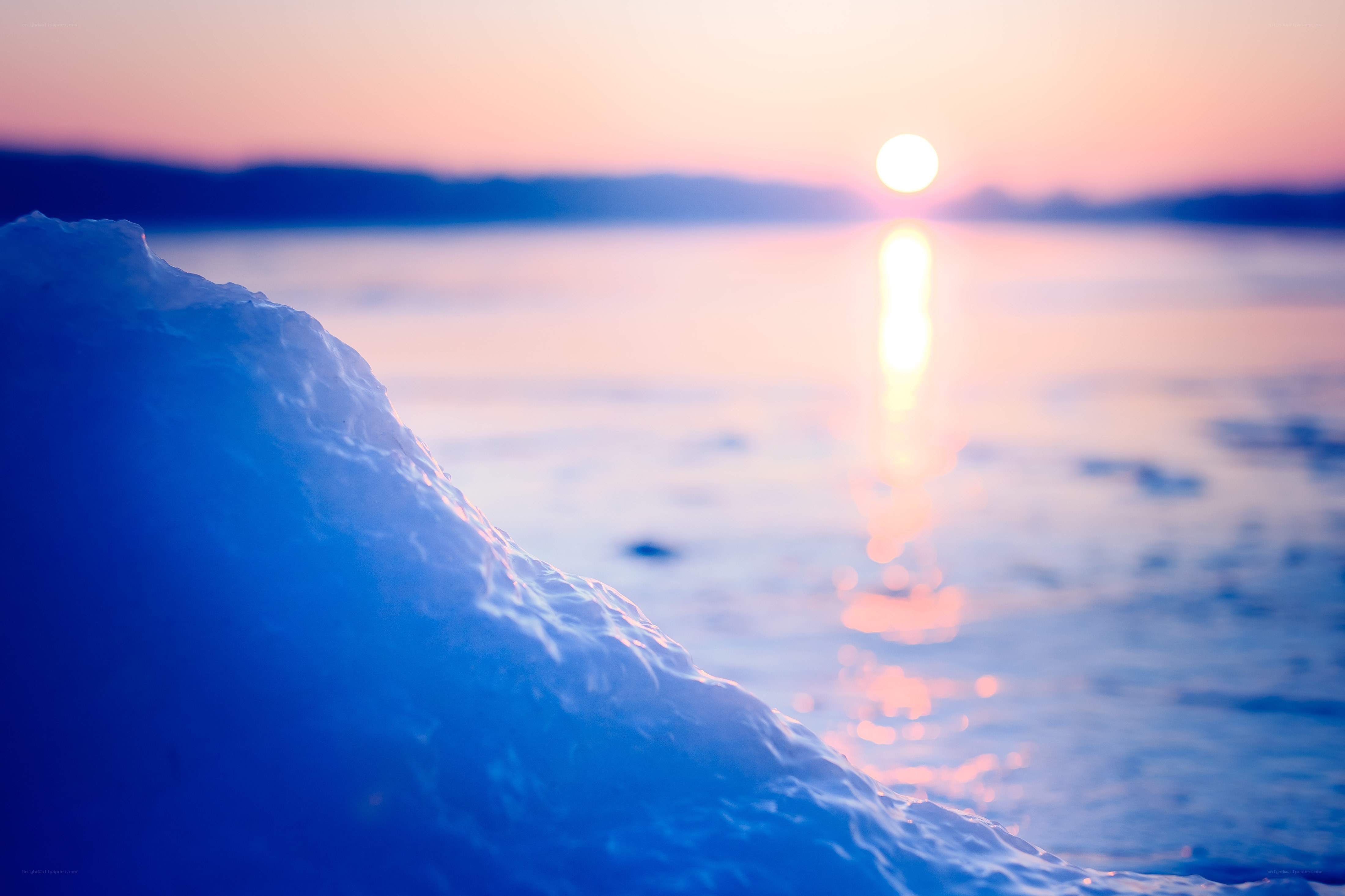 Sunset over icy lake