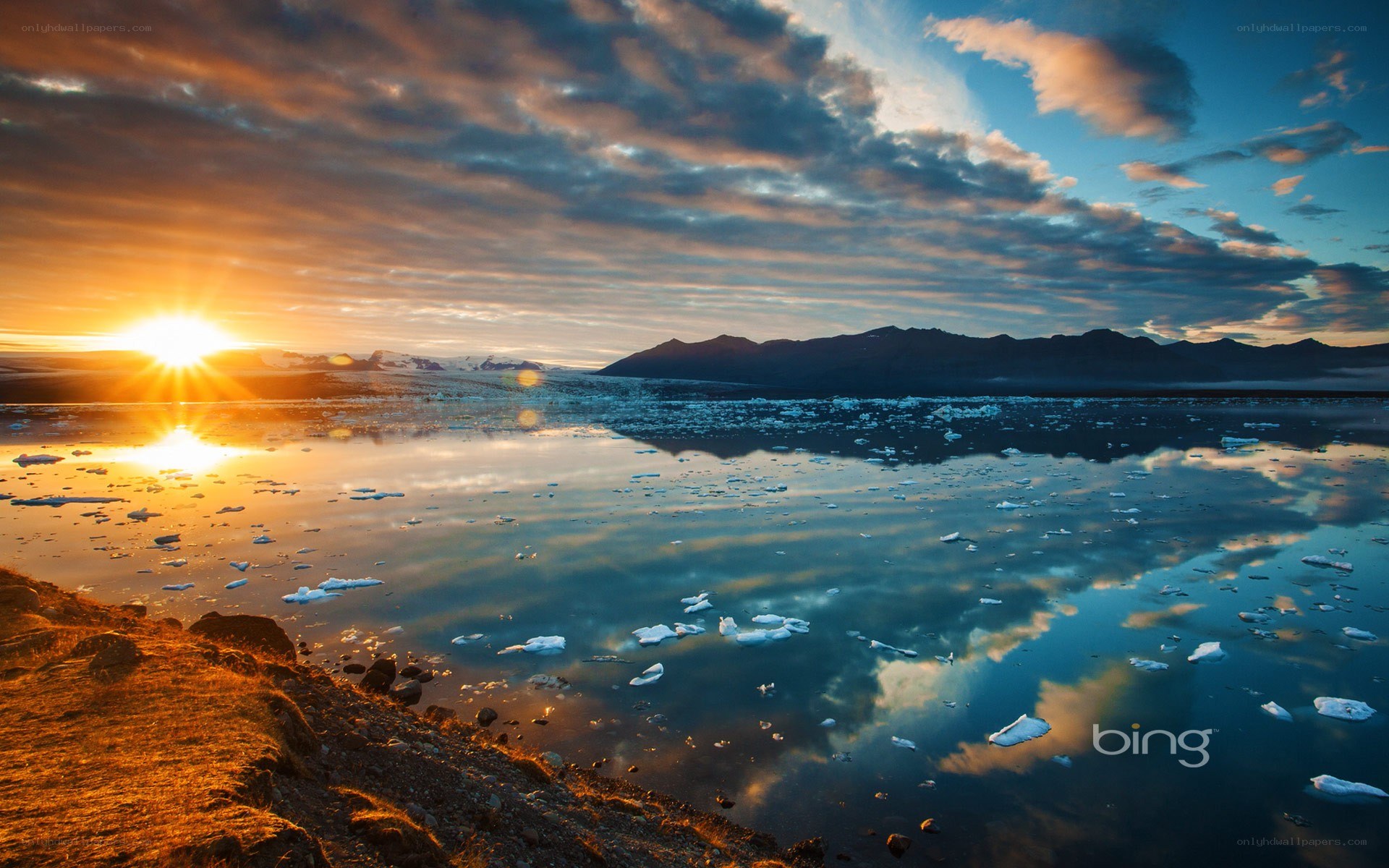Sunset over icy lake