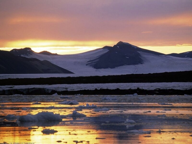 Sunset over icy mountains