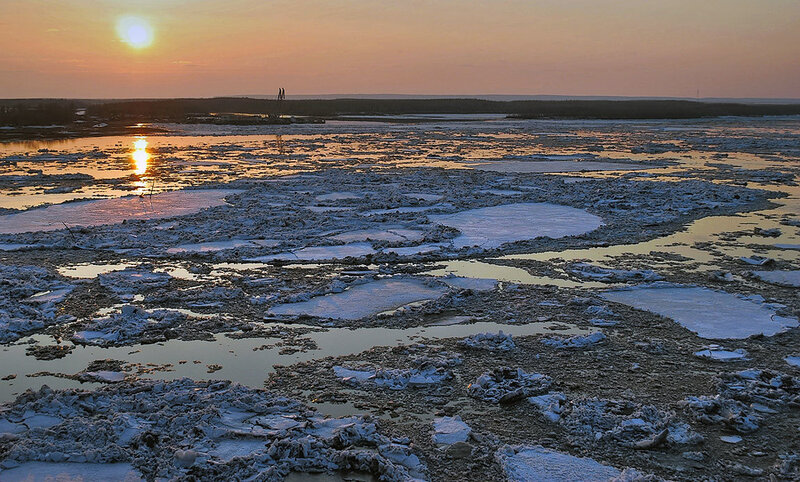 Sunset over icy river