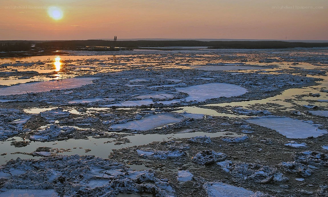 Sunset over icy river