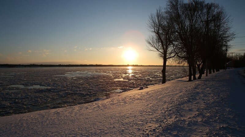 Sunset over icy river