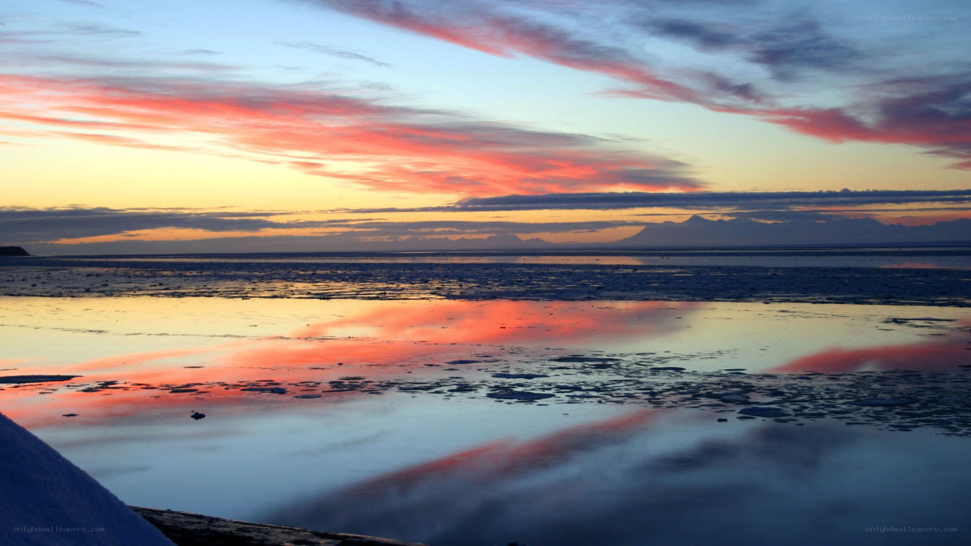 Sunset over icy water