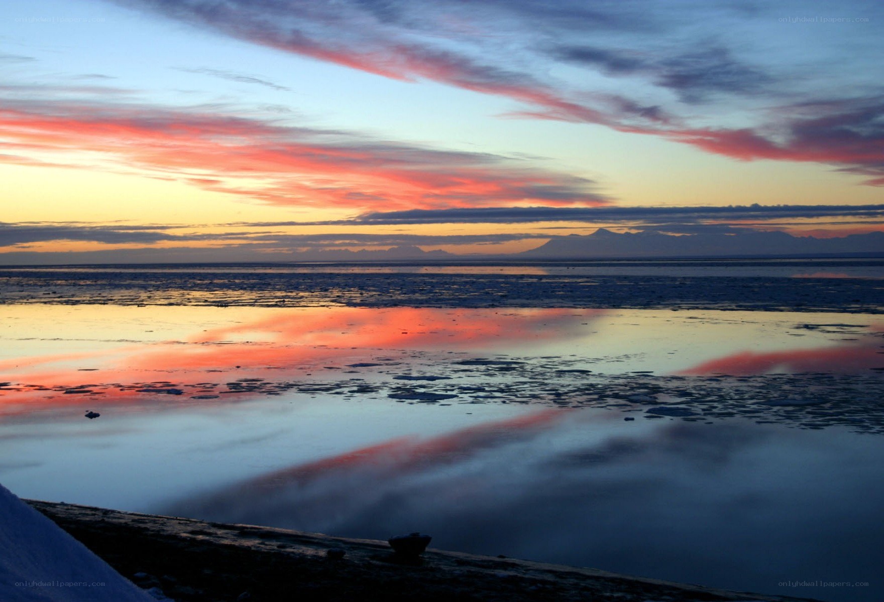 Sunset over icy water