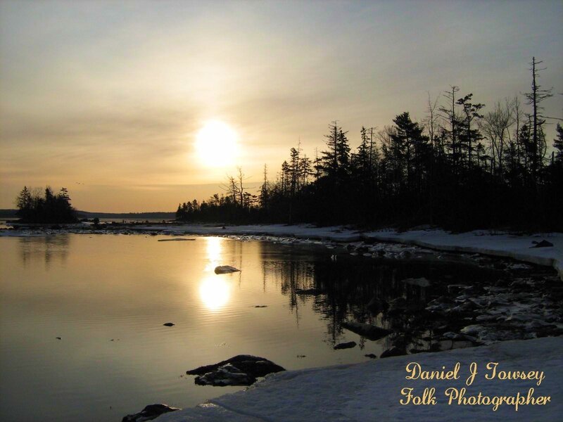 sunset over icy water