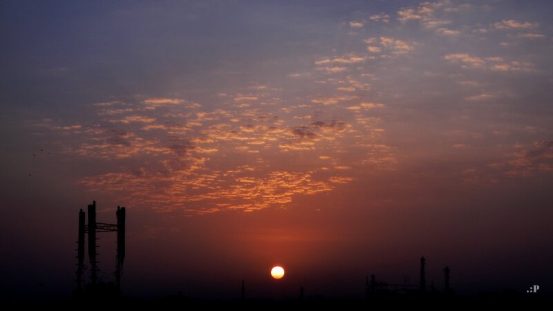 Sunset over Industrial Area — Orange