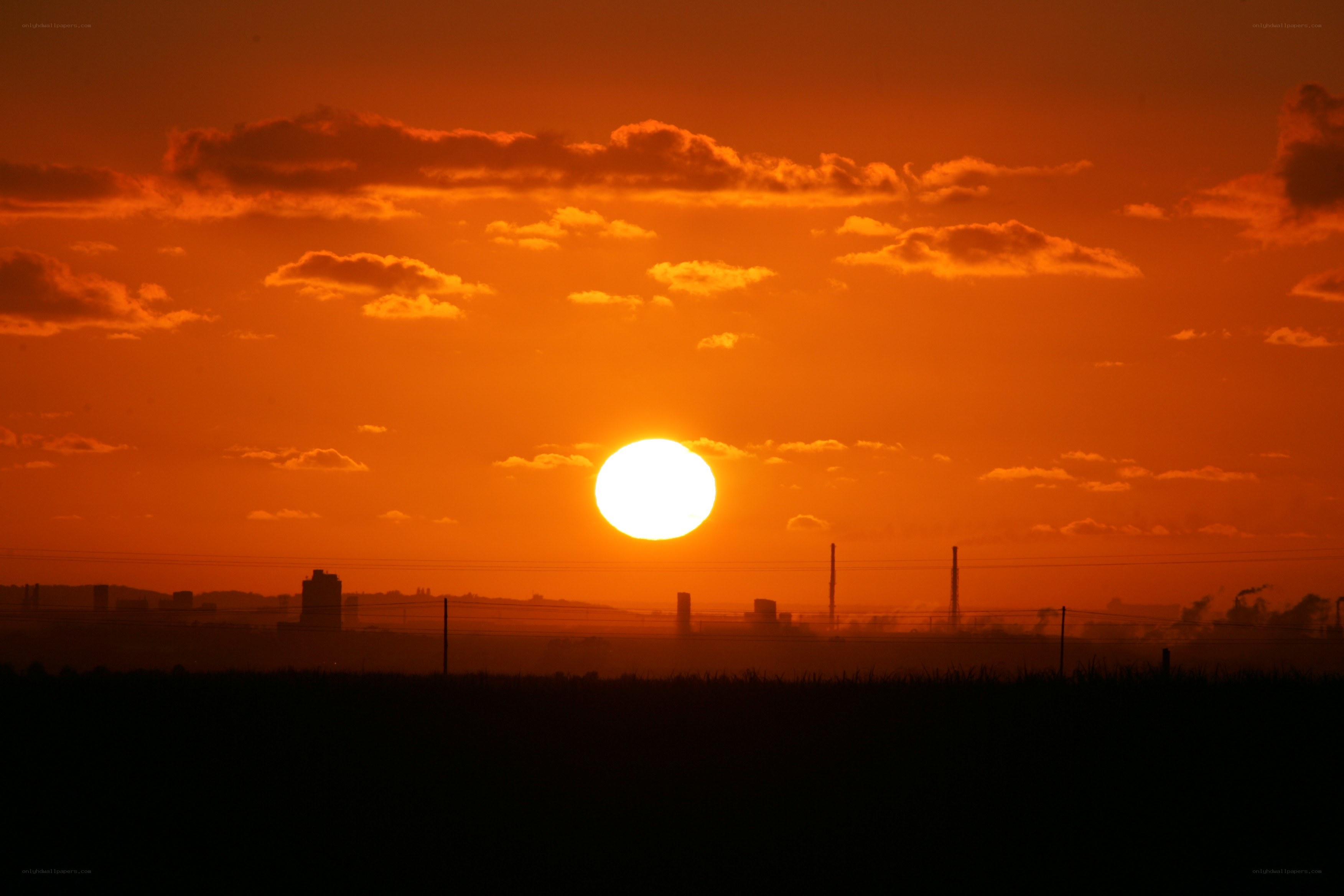 Sunset over industrial landscape