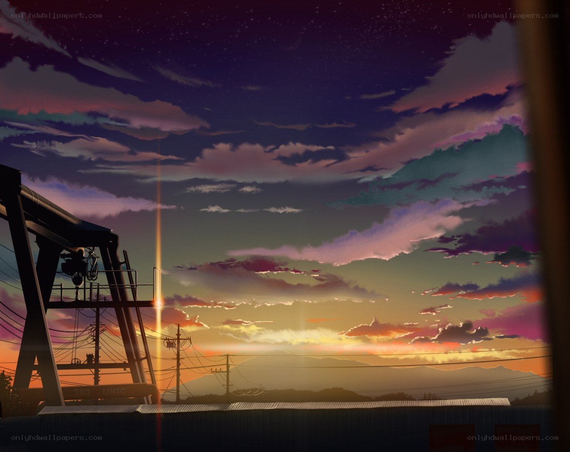 sunset over industrial landscape