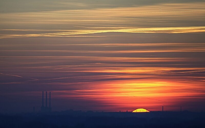 Sunset over industrial landscape