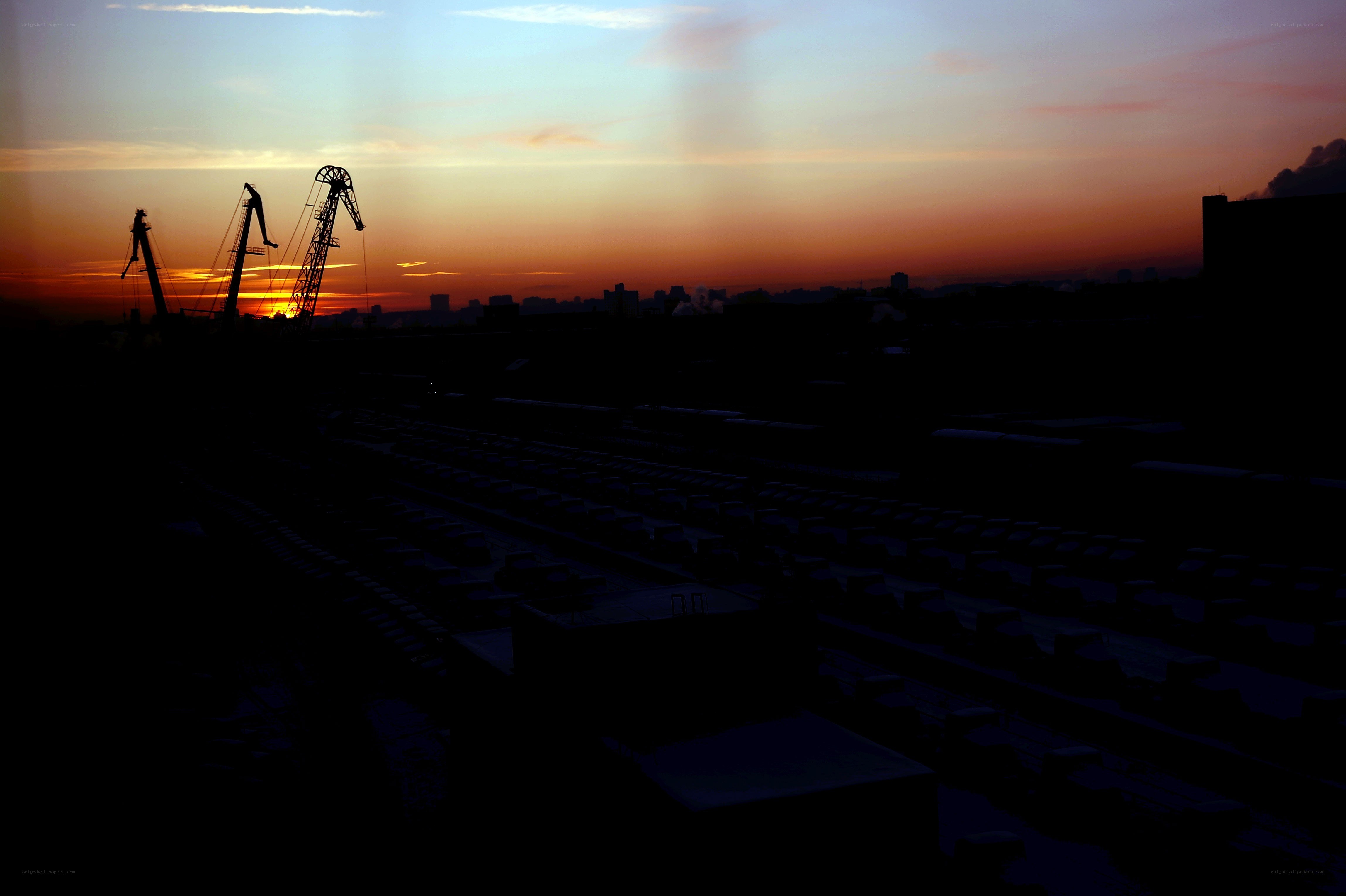 Sunset over industrial port