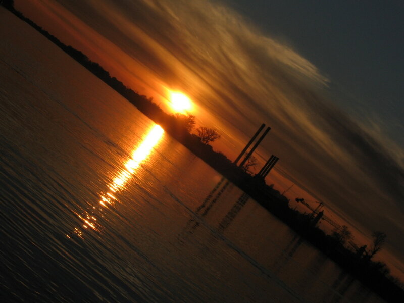 Sunset over industrial river
