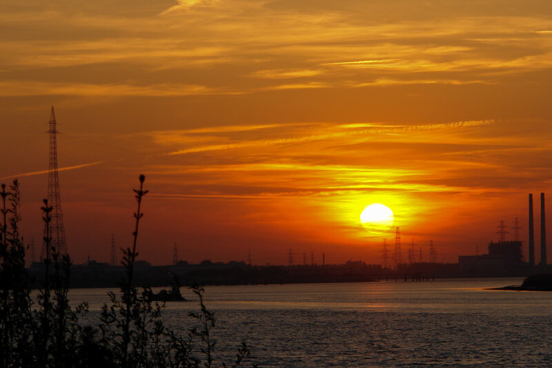 Sunset over Industrial River — Orange, Dramatic