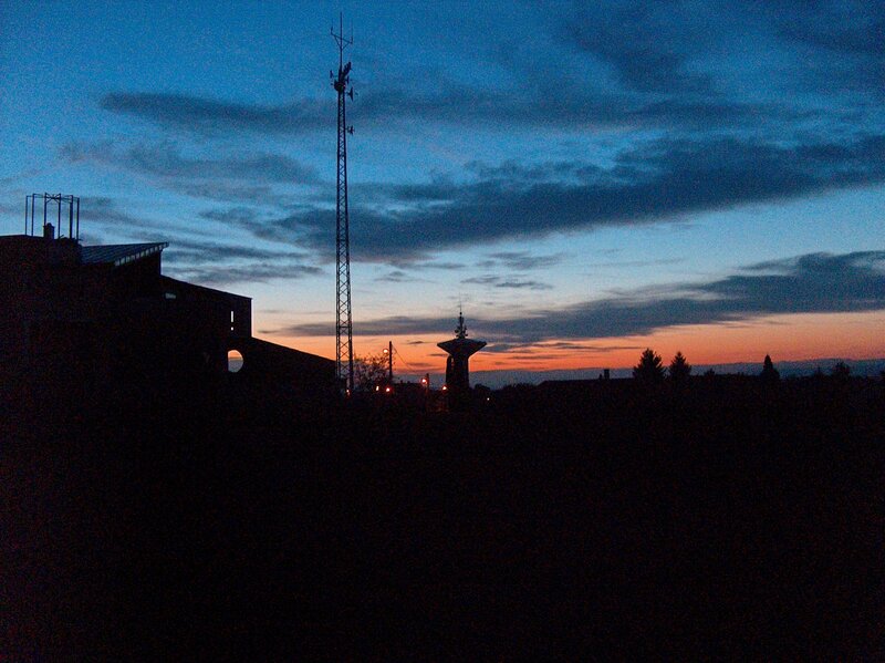 sunset over industrial structures