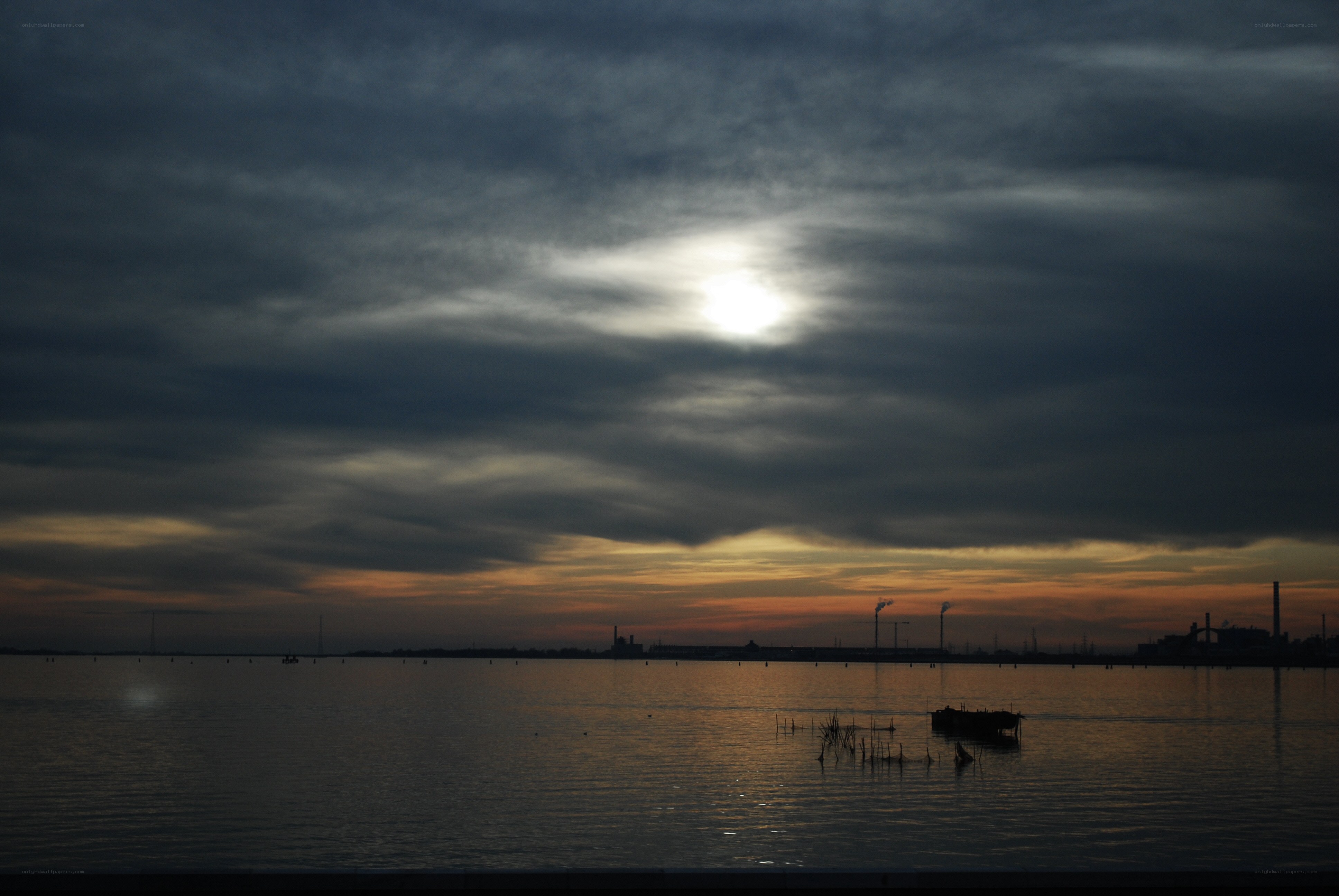 Sunset over industrial waterfront