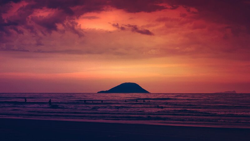 sunset over island silhouette