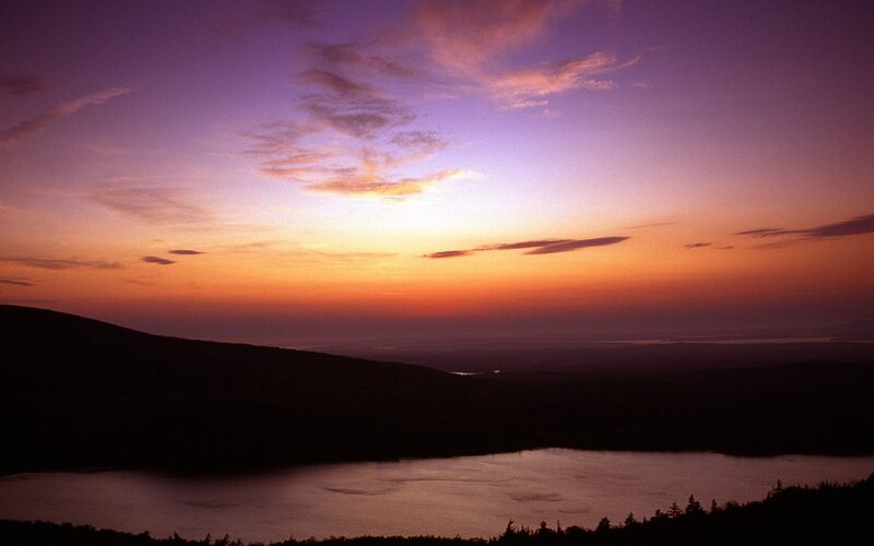 sunset over lake and hills