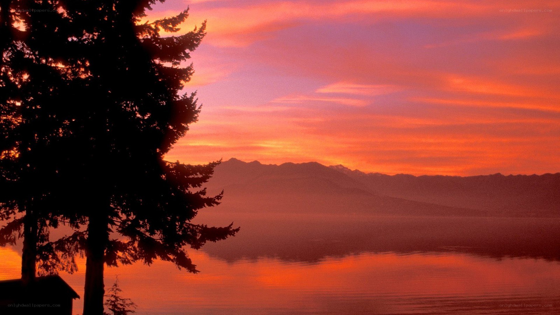 sunset over lake and mountains