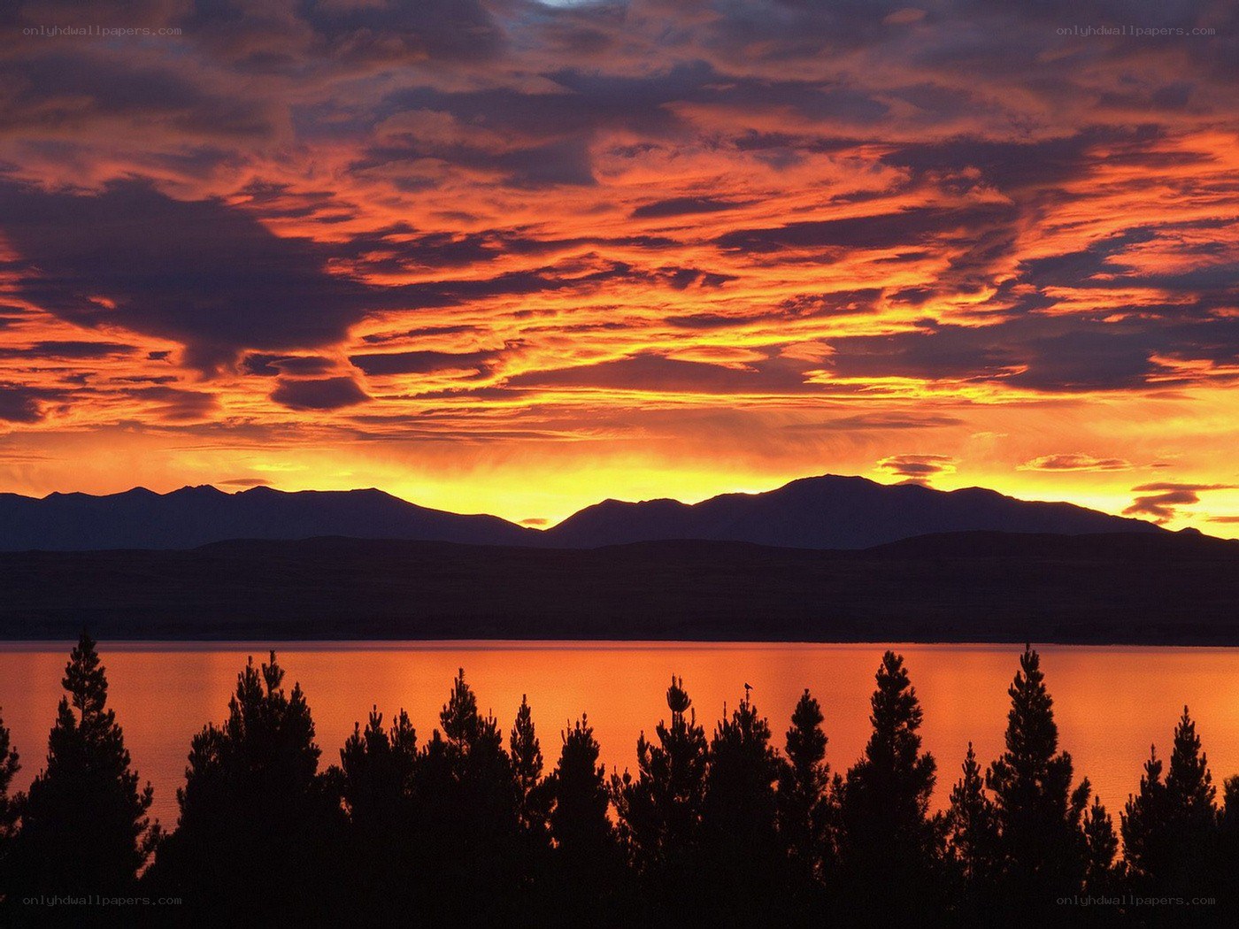 Sunset over lake and mountains