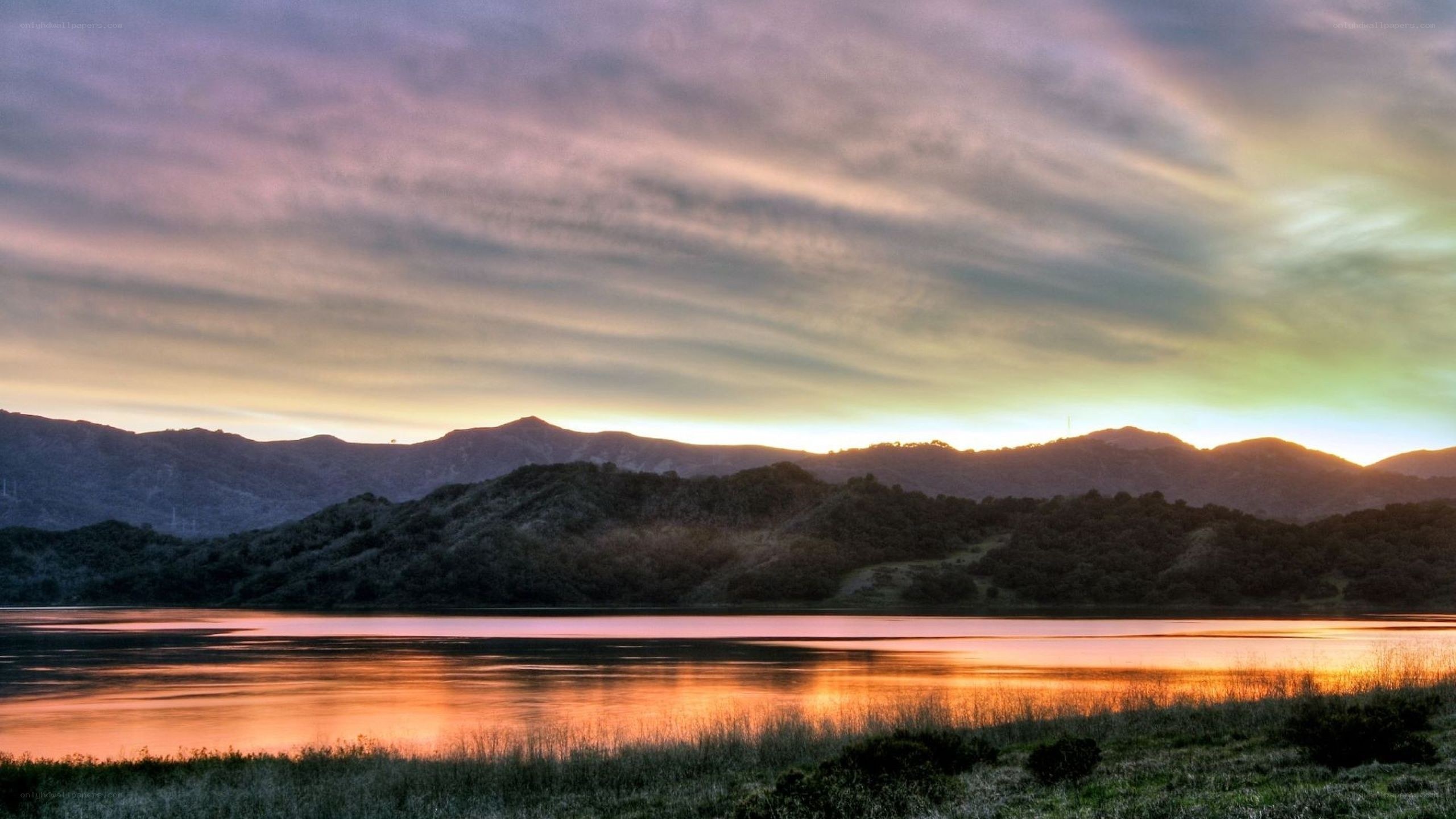 sunset over lake and mountains