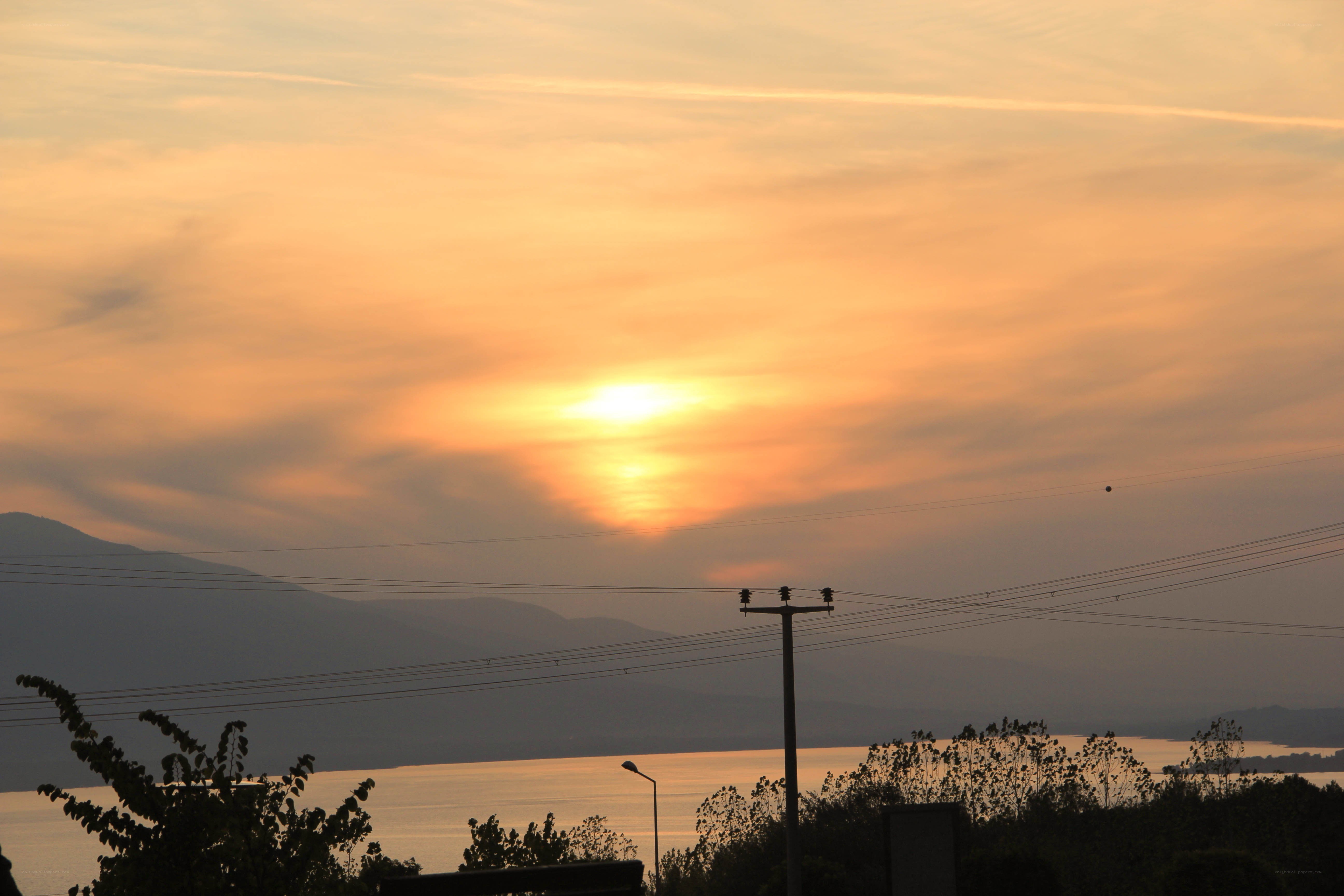 Sunset over lake and mountains