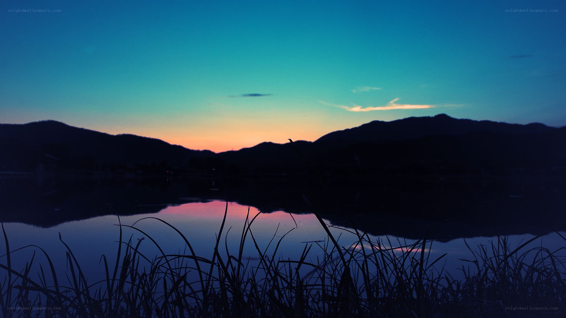 sunset over lake and mountains