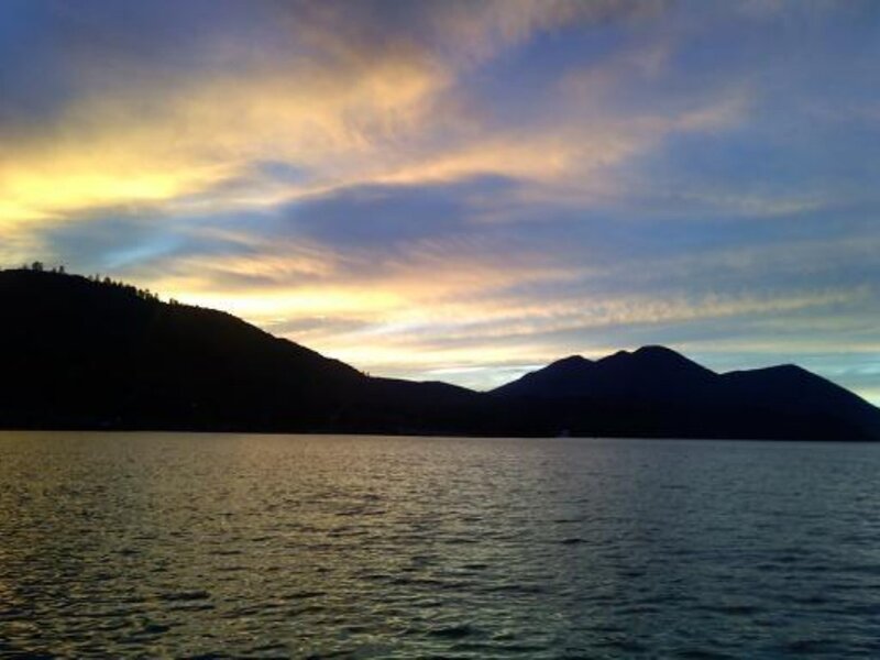 sunset over lake and mountains