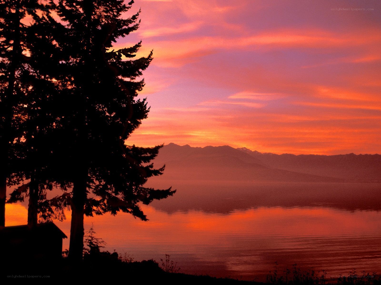 Sunset over lake and mountains