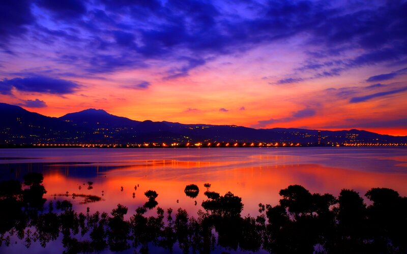 Sunset over Lake and Mountains — Purple, Dramatic