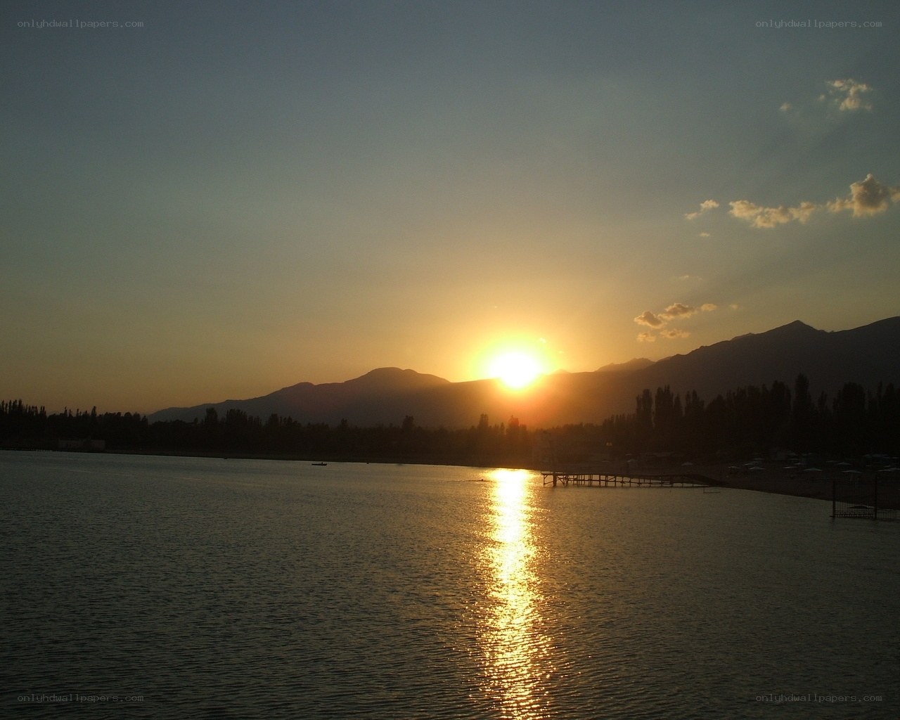 Sunset over lake and mountains