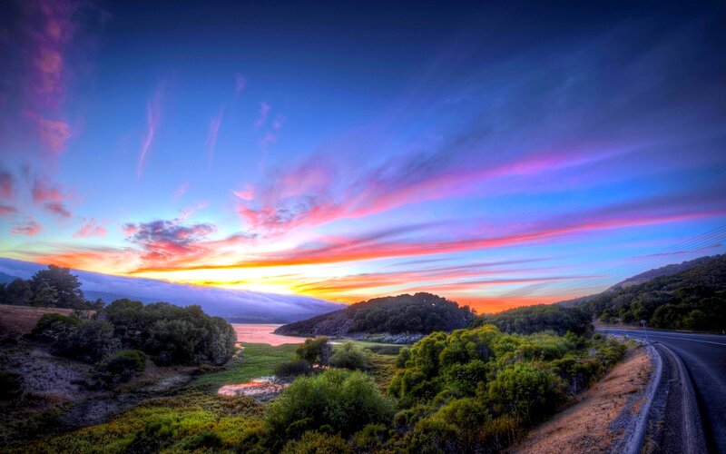 Sunset over Lake and Road