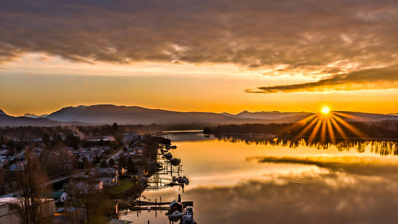Sunset over Lake and Town — Orange, Serene