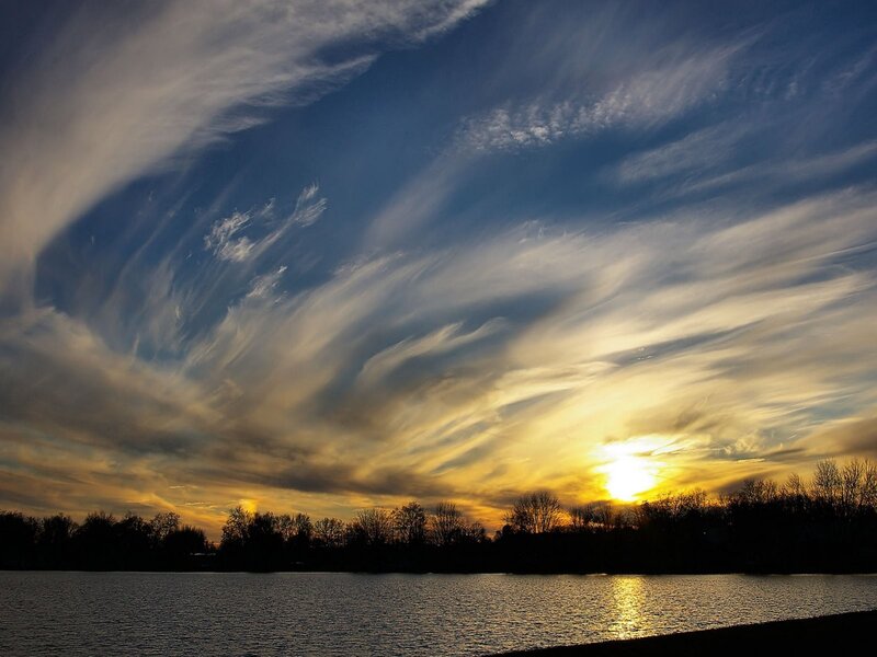Sunset over Lake — Blue, Dramatic, Photograph, Clouds, Trees, Sun, Yellow, Black